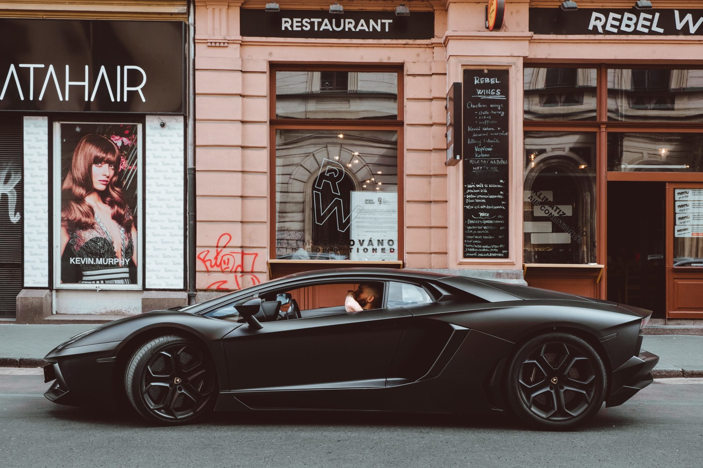 Fancy car in front of European buildings