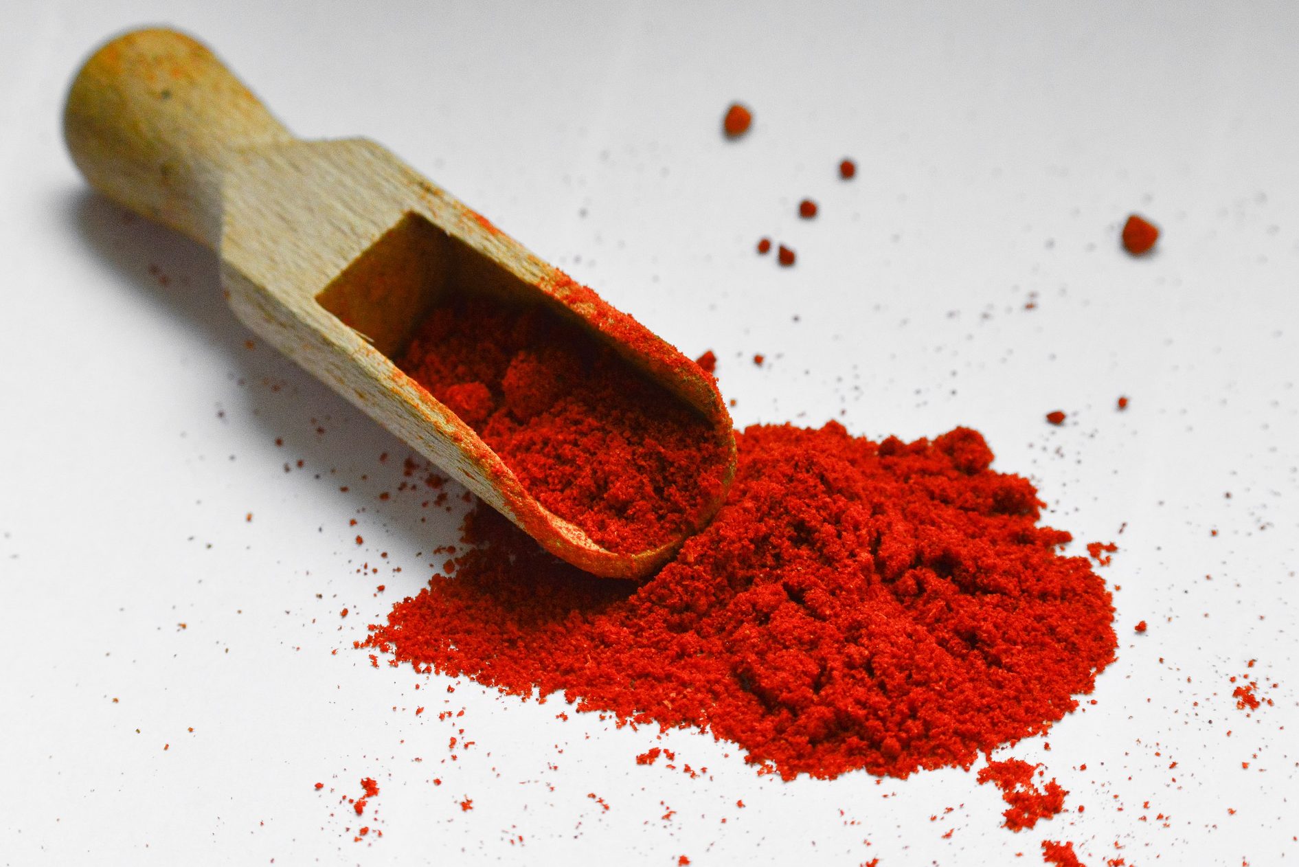 Paprika with a wooden spoon